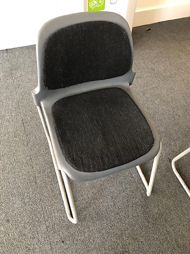 Grey plastic waiting room chair