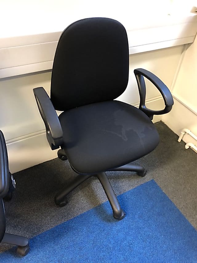 Black rolling operator chair