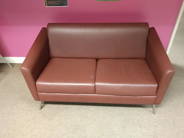 Brown two seater sofa