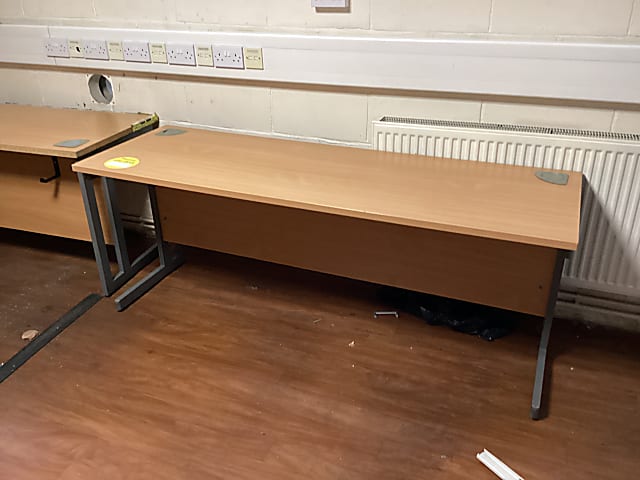 brown wooden desk with gray metal base