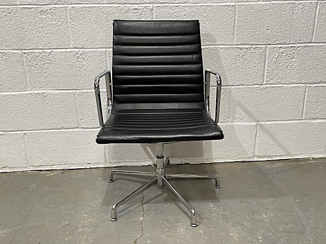 black leather padded chair eames style