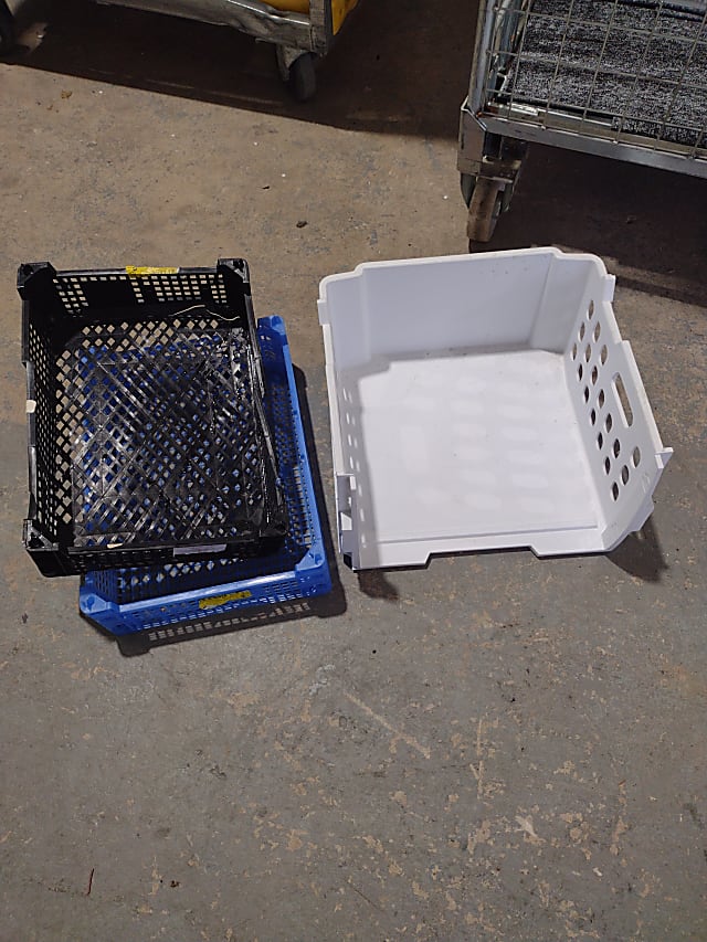 two white and blue plastic crates