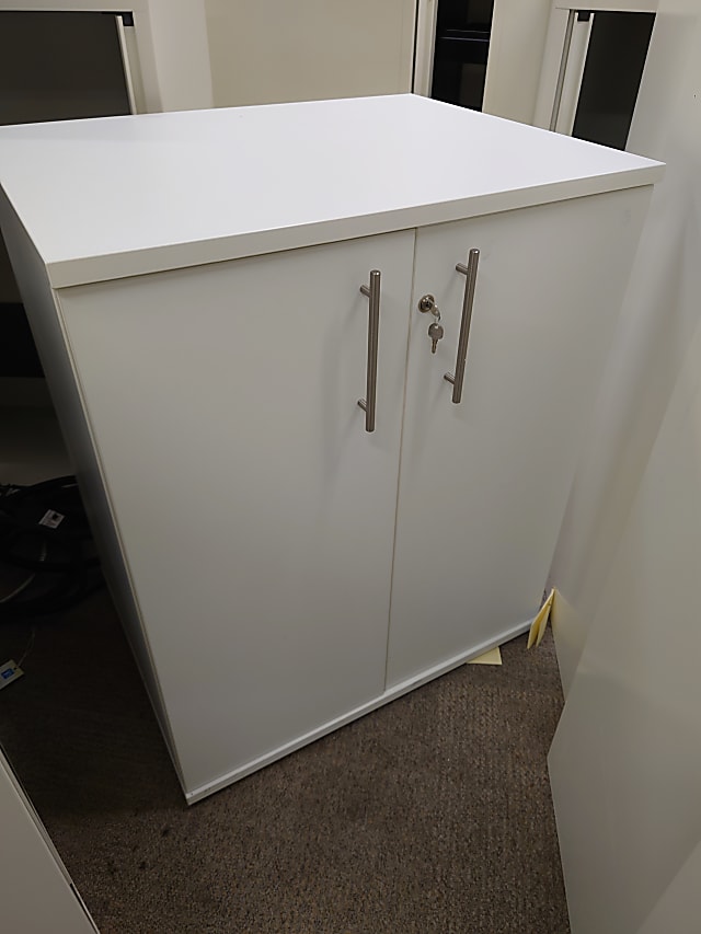 white wooden 2 door cabinet 