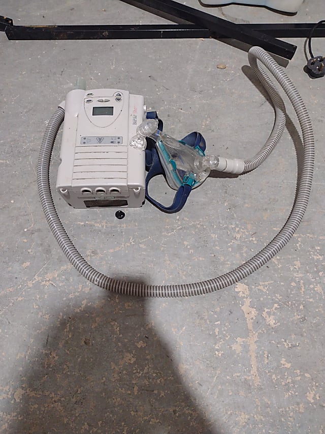 white and blue nebulizer machine