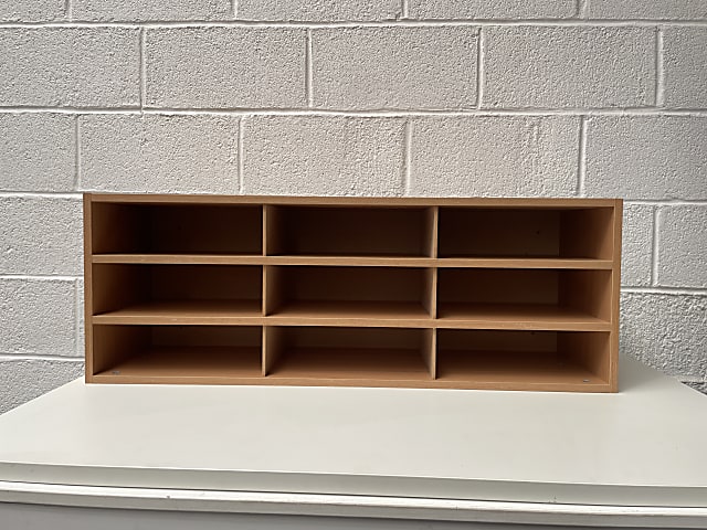 brown wooden 9-cube shelf pigeon holes