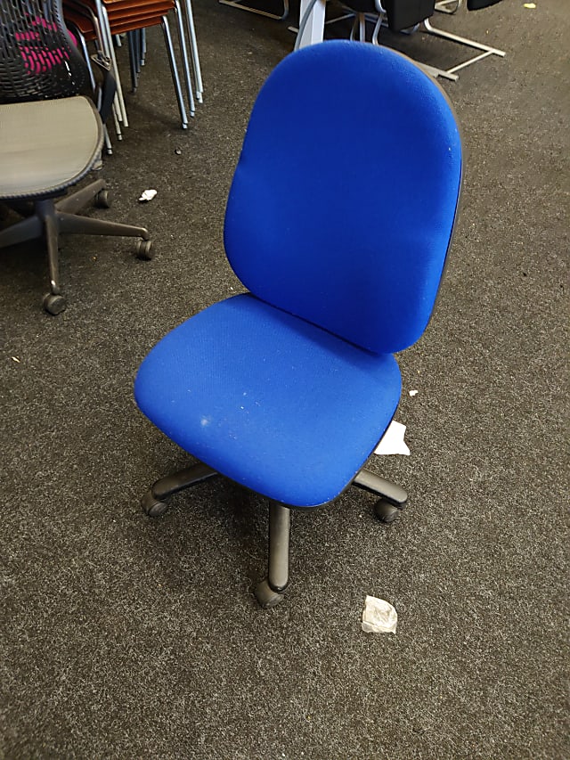 Blue operator chair with no arm rests 