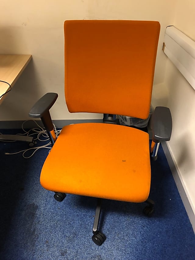 Bright orange operator arm chair