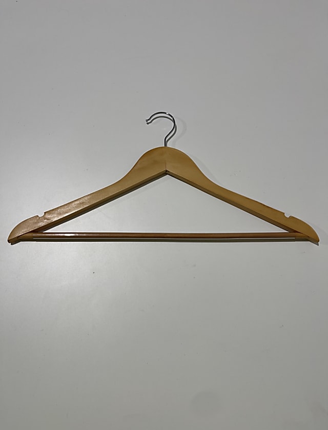 brown wooden clothes hanger rack