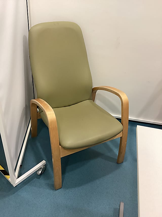 brown wooden framed green padded armchair