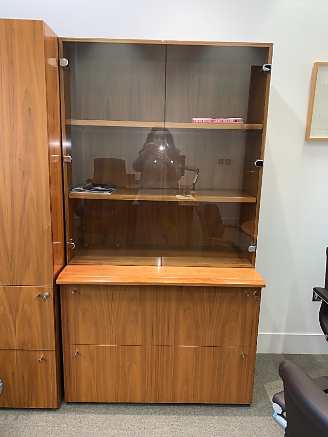 Glass fronted wooden display cabinet