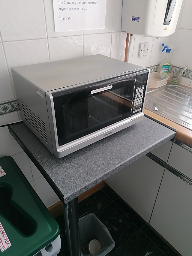 stainless steel and black microwave oven