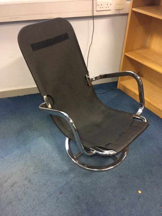 Rocking spinning chair with chrome frame