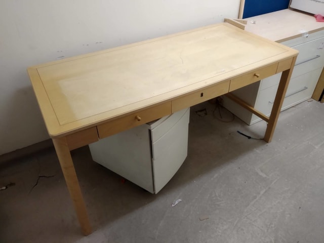 rectangular brown wooden table with three integral drawers