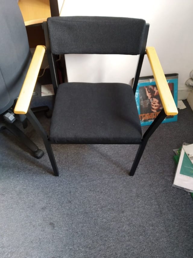 black and brown fabric padded armchair