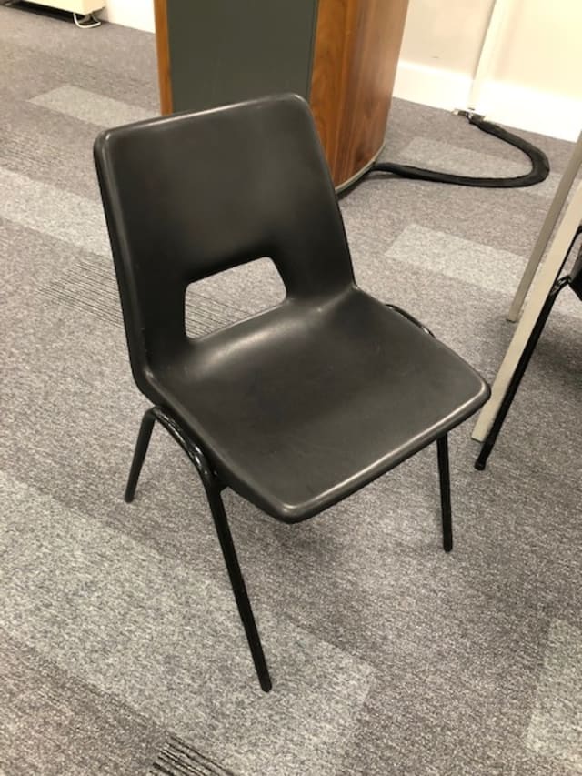 Black plastic waiting room chair