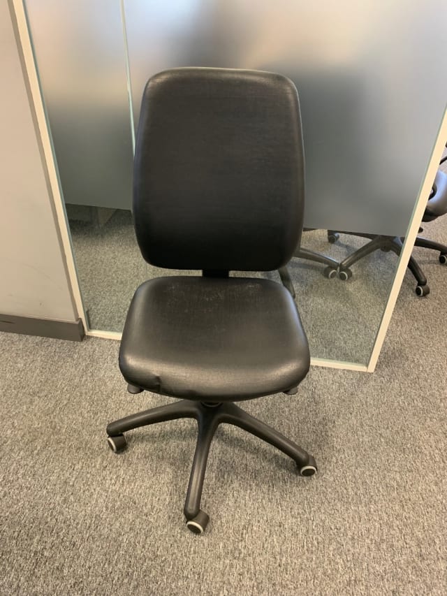 Black leather effect operator chair