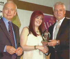 Margaret of Ray Grahams Receiving an Award