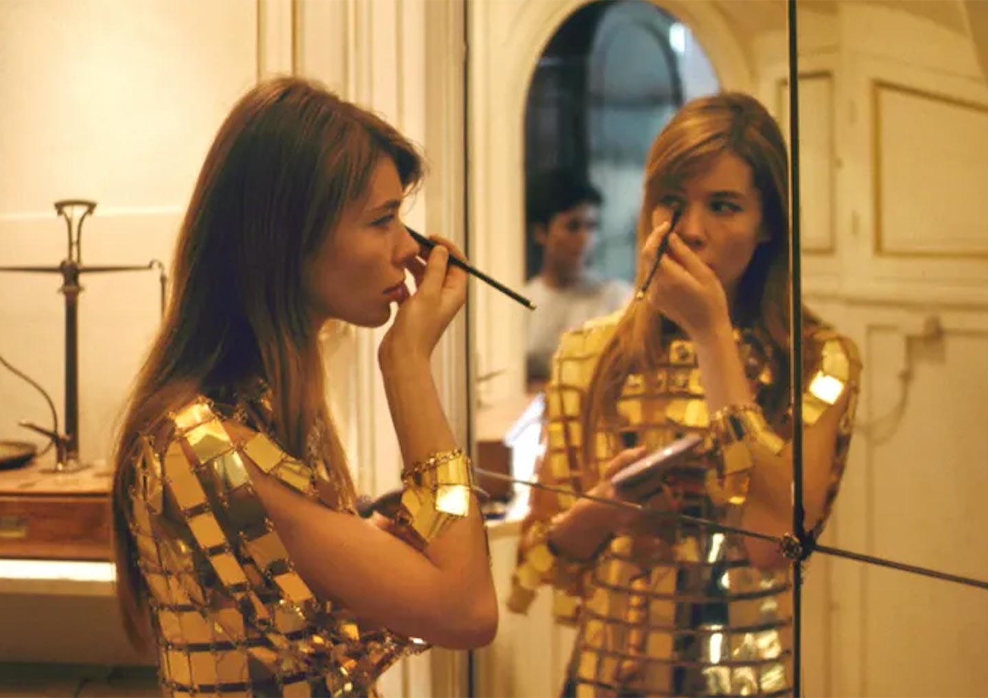 Françoise Hardy wearing a Paco Rabanne gold plate dress in 1968