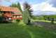 rhoen-pension-glocke-aussen-sommer