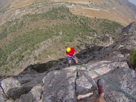 ... and rappelling back down again.