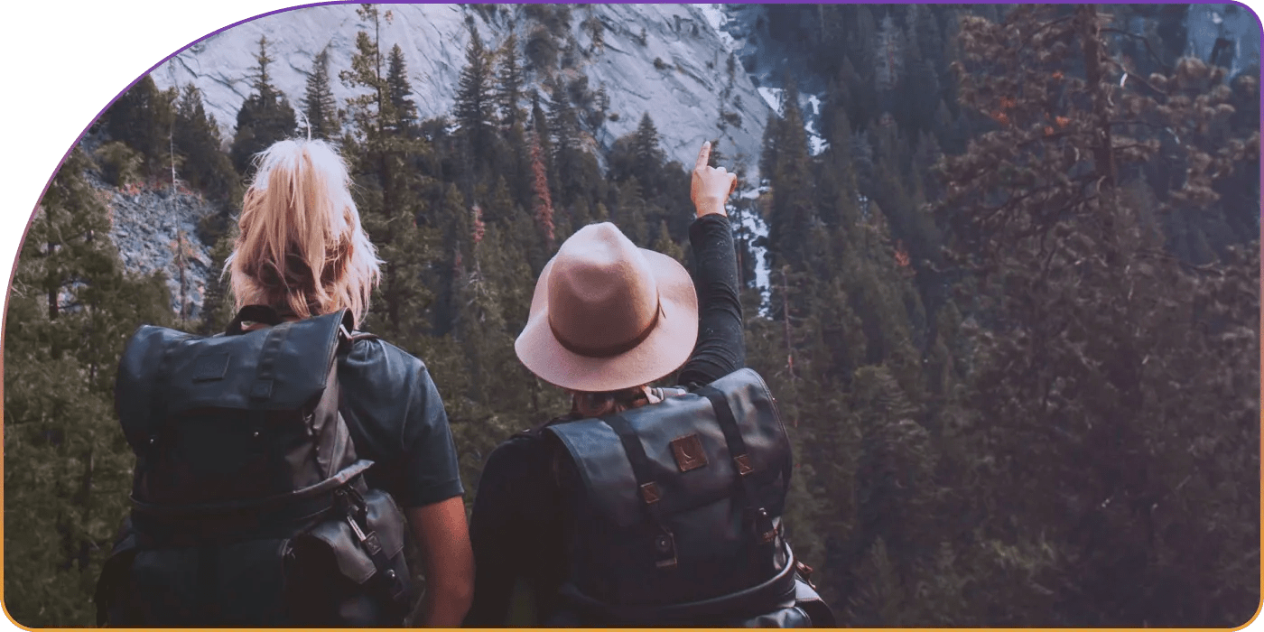 team-pointing-towards-mountain