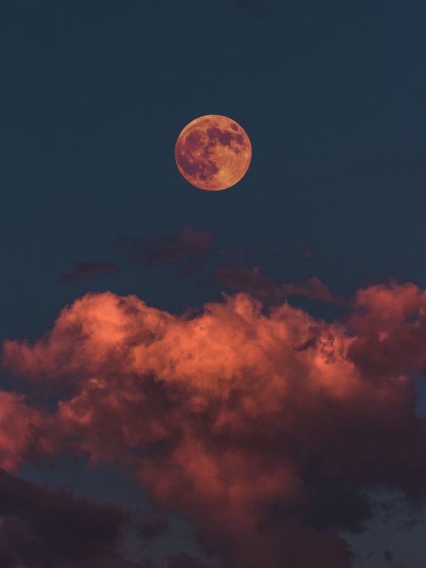 Red Moon Over Clouds