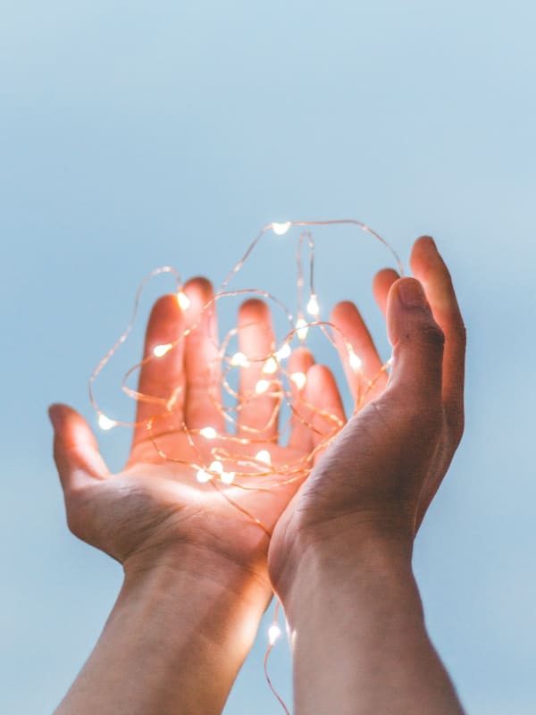 Hands Holding Fairy Lights