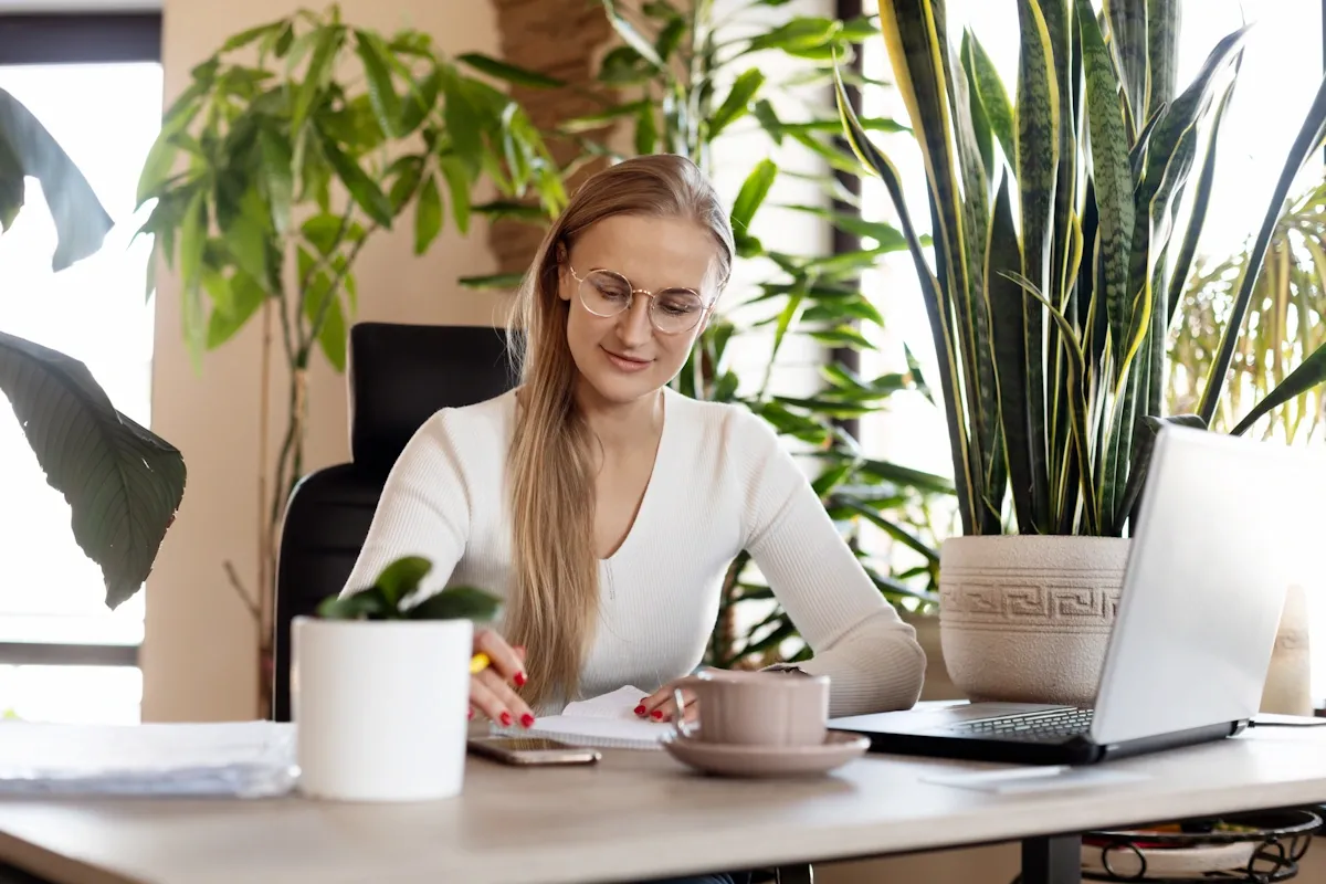 Woman reading the ulimate expense management guide.webp