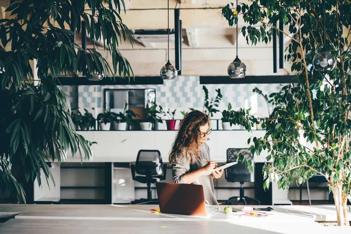Woman taking notes on business sustainability