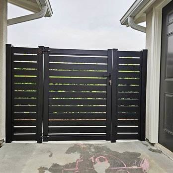 Aluminum walk gate with matching perimeter fence