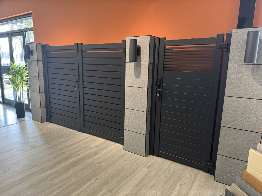 Black aluminum double swing gate on display