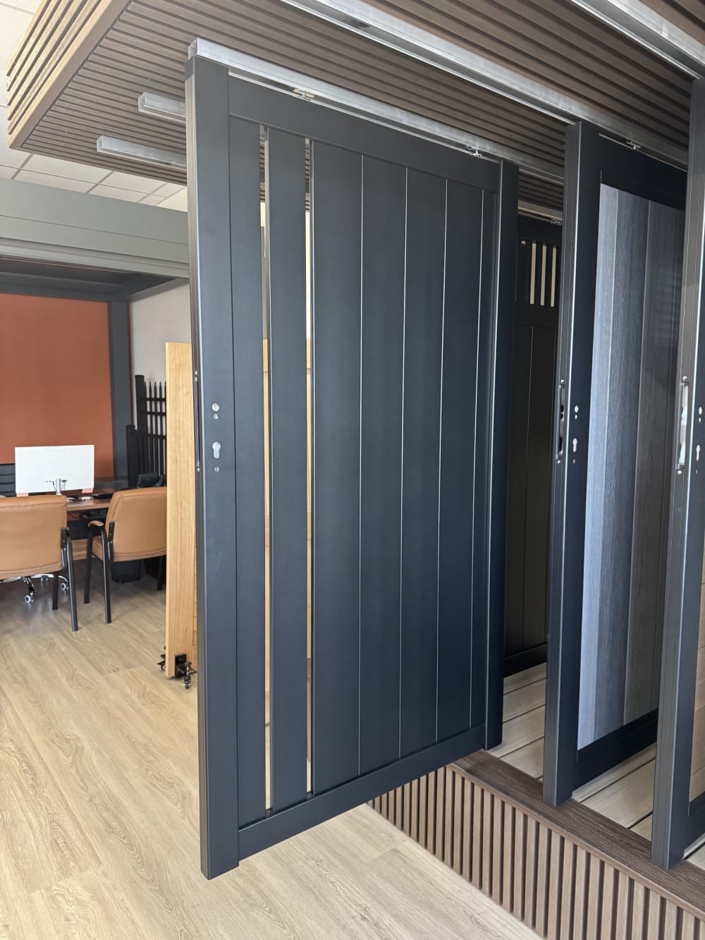 Black aluminum gate with vertical slat infill on the Rosemead showroom floor