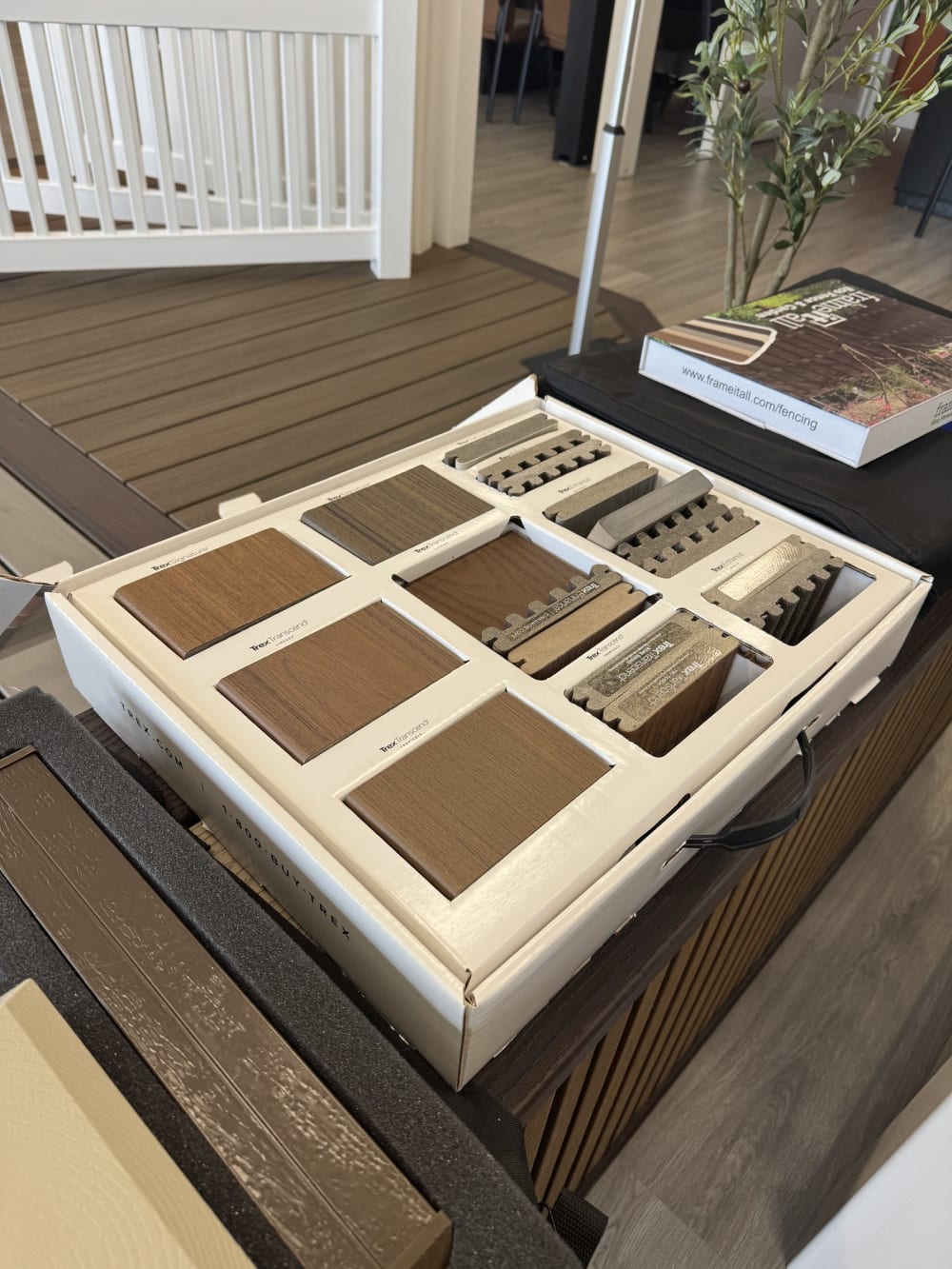 Composite decking sample tray showing woodgrain colour options