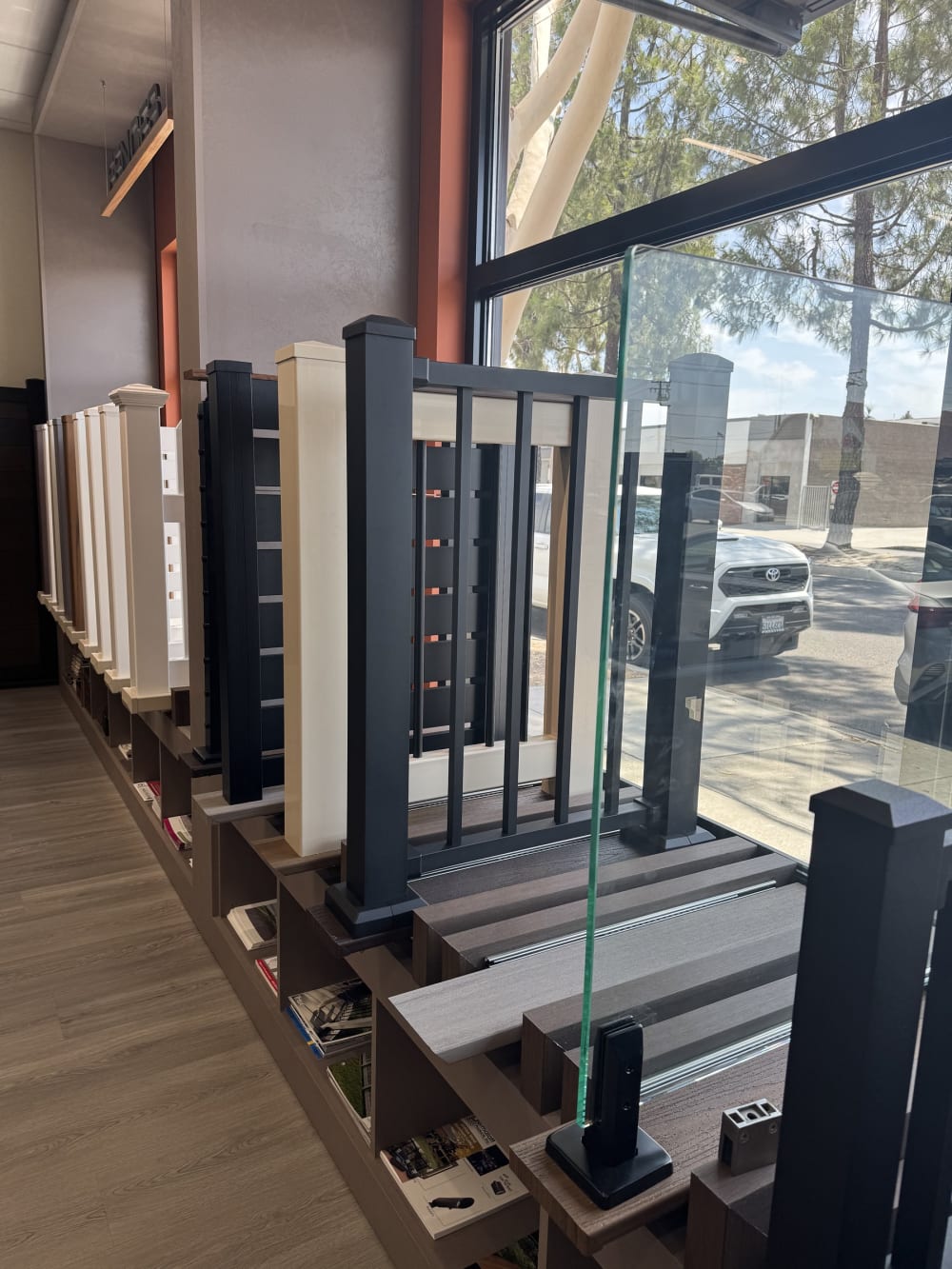 Railing display wall with glass, metal baluster and composite post options