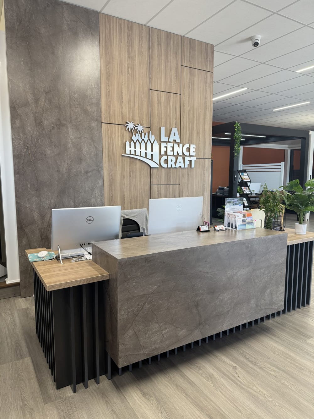 Reception desk and LA Fence Craft logo wall at the Rosemead showroom