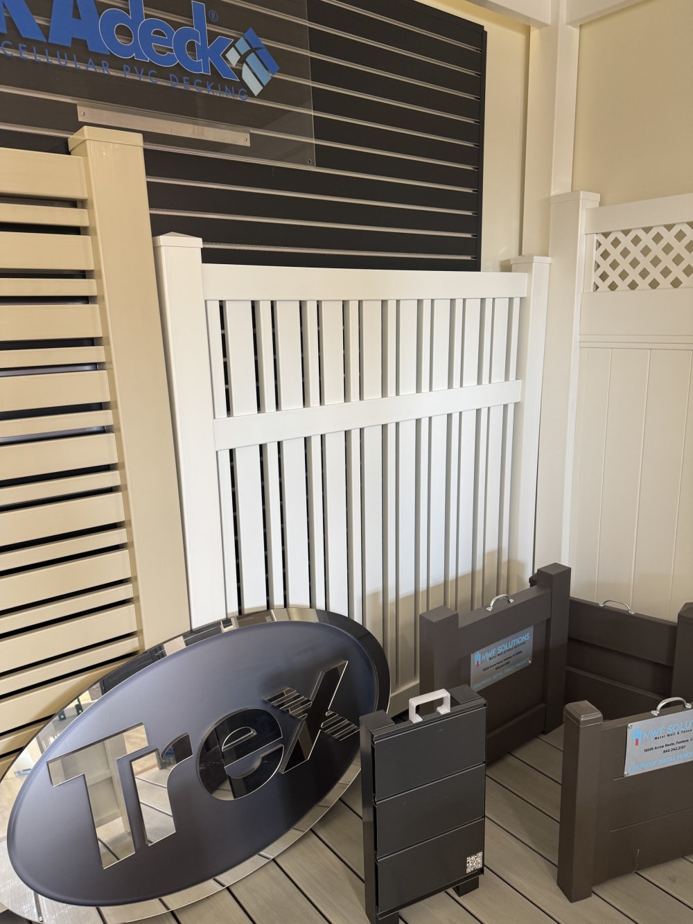 VEKA vinyl fence panels including lattice-top and privacy styles on display