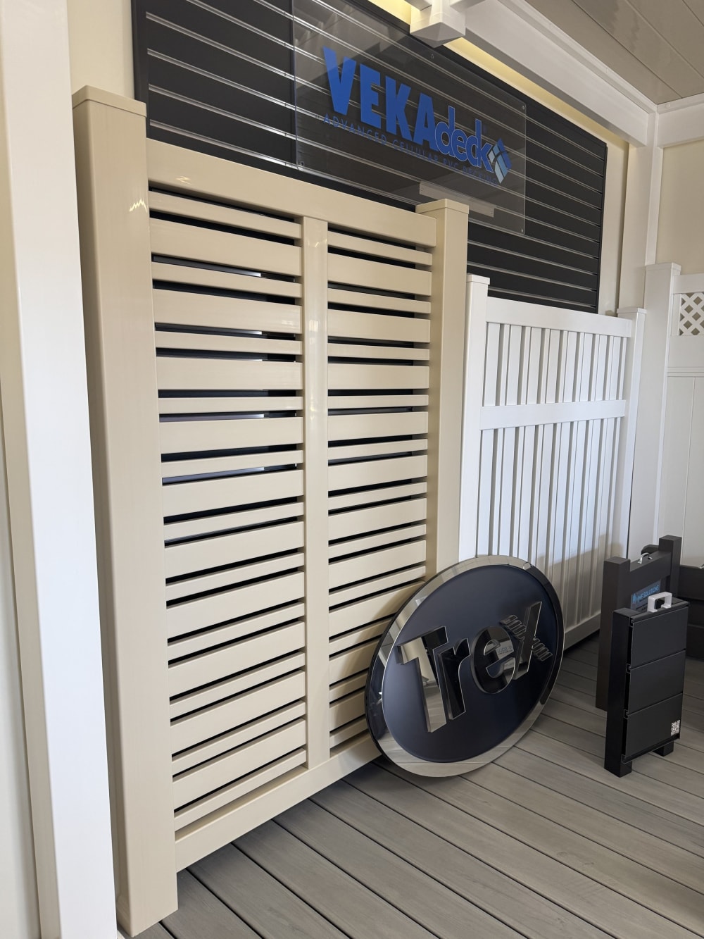 VEKA vinyl fence display wall with Trex signage in the Rosemead showroom