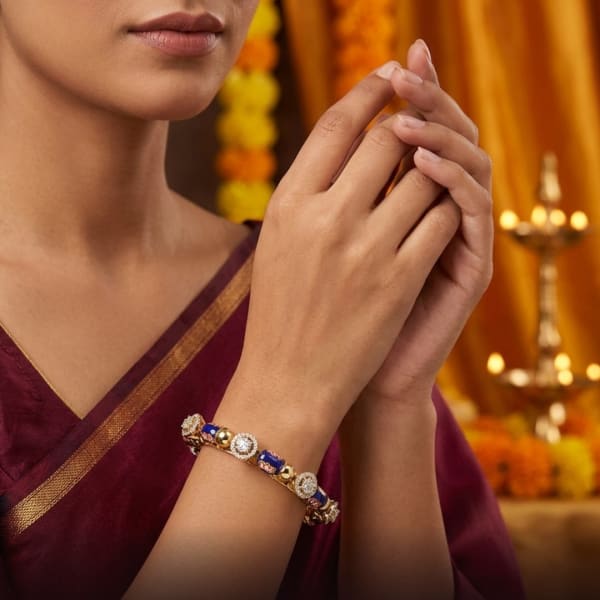 Royal blue enamel meets diamond halos on gold.