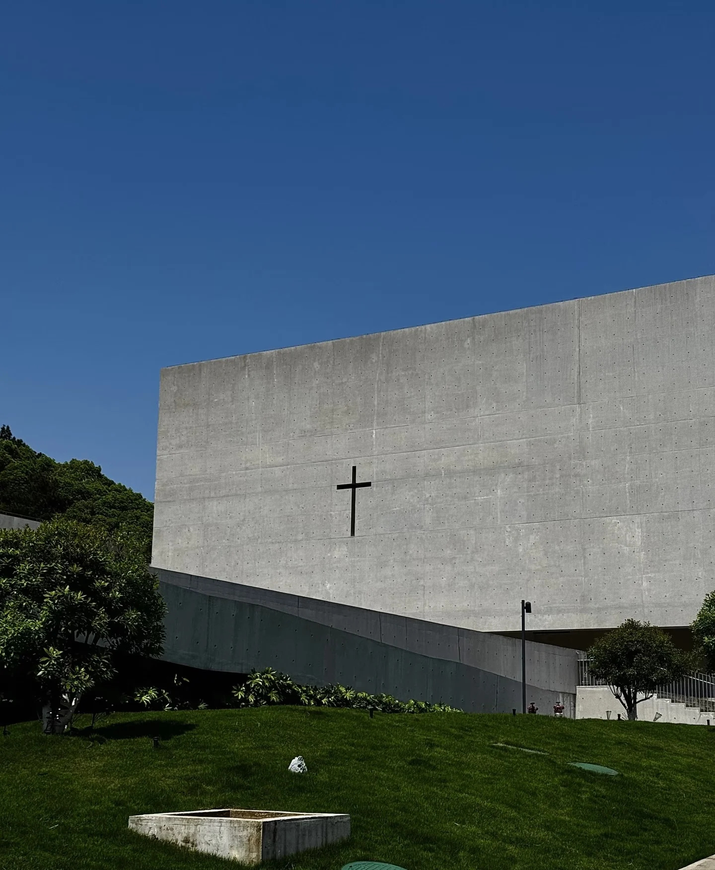 Modern church building with a cross under a blue sky