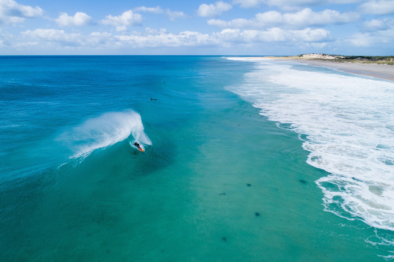 Surfer at Martha Lavinia on King Island