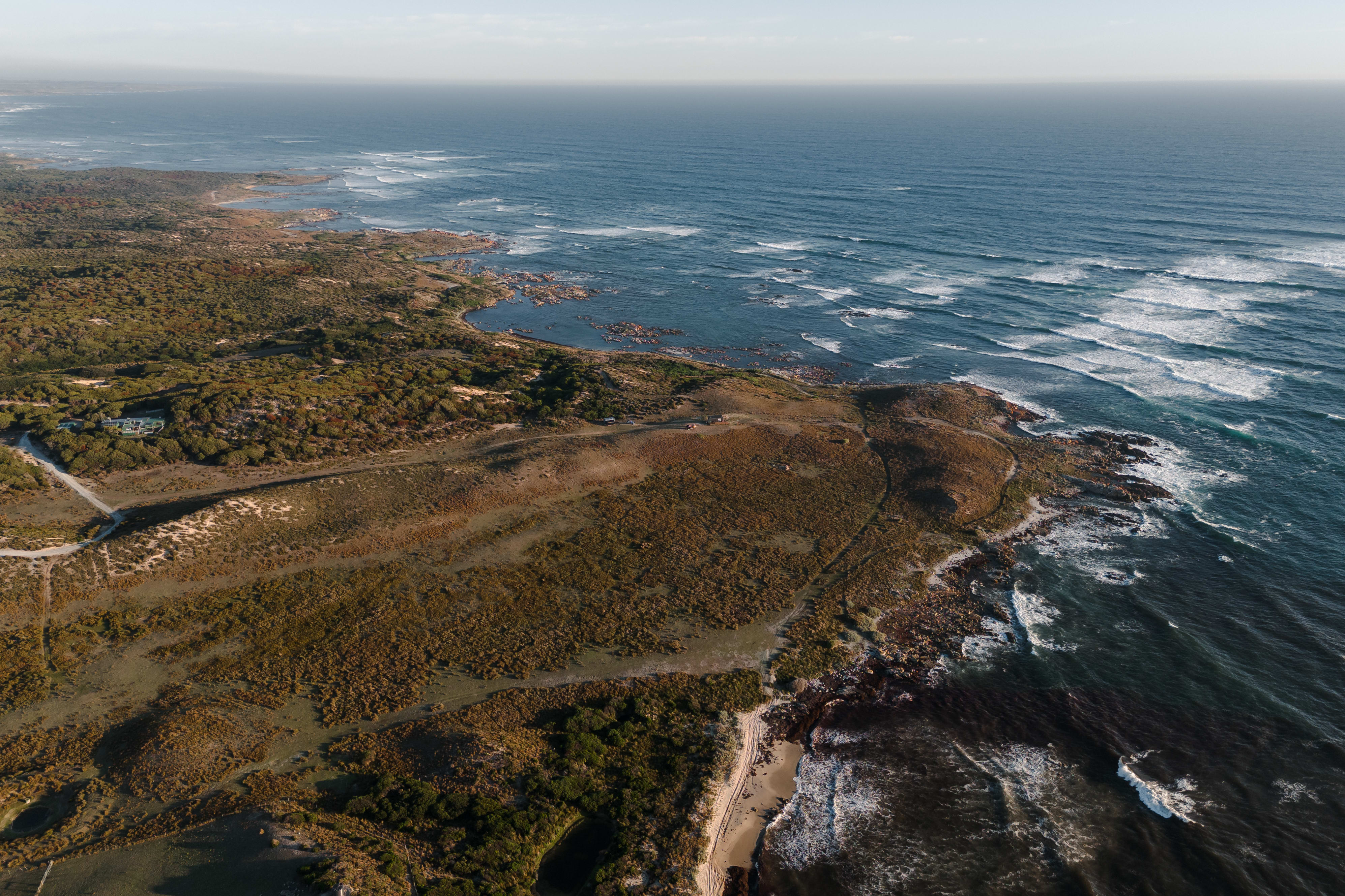 Red Rock Hut surrounded by coastal landscape on King Island, Tasmania