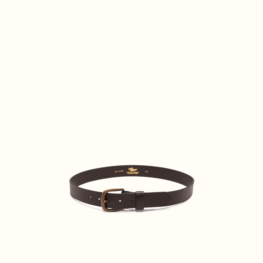 Black leather belt with brass buckle by Butts and Shoulders