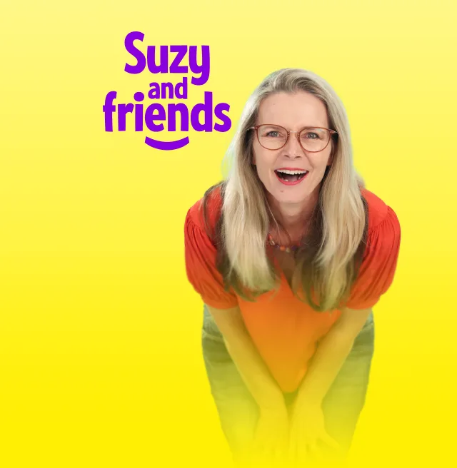 A smiling woman with red rimmed glasses leans forward in a friendly way. Text reads "Suzy and friends"