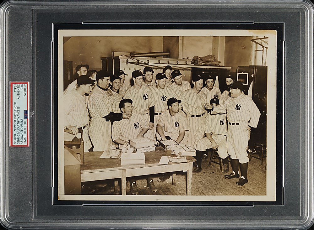 1936 World Champions New York Yankees Team with Lou Gehrig and Rookie Joe DiMaggio Signing Baseballs Original Associated Press Photograph PSA/DNA Type I