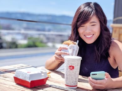 Jesi, Roboboogie Producer, enjoying Jack in the Box on the rooftop deck