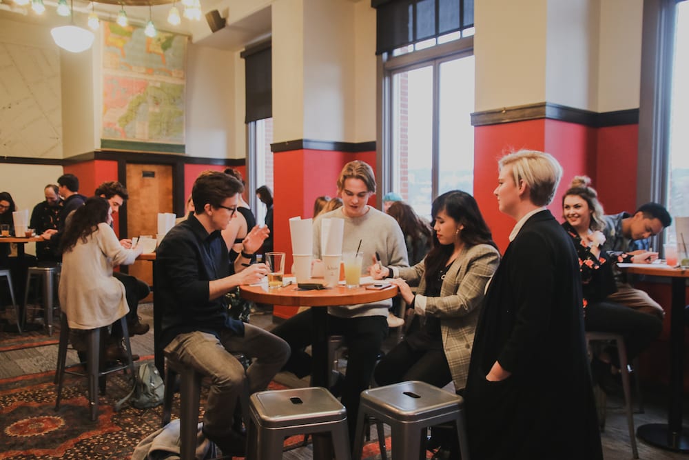 People in conversation at March Camp Optimization