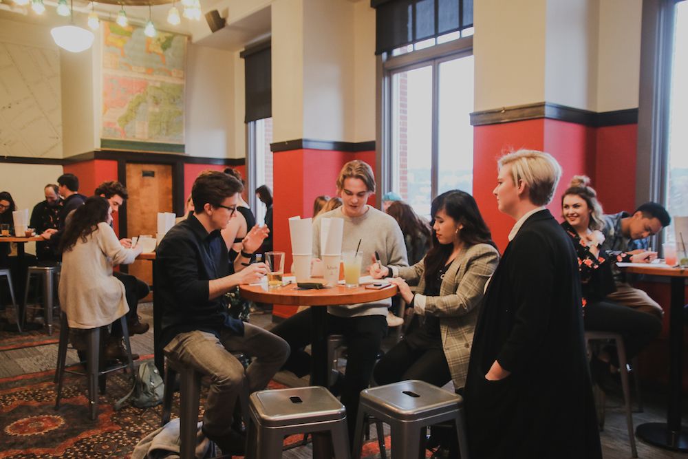 People in conversation at March Camp Optimization