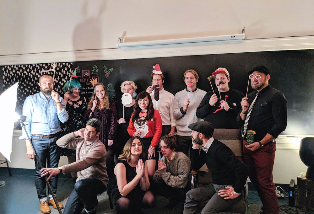 roboboogie team posing for a holiday team photo