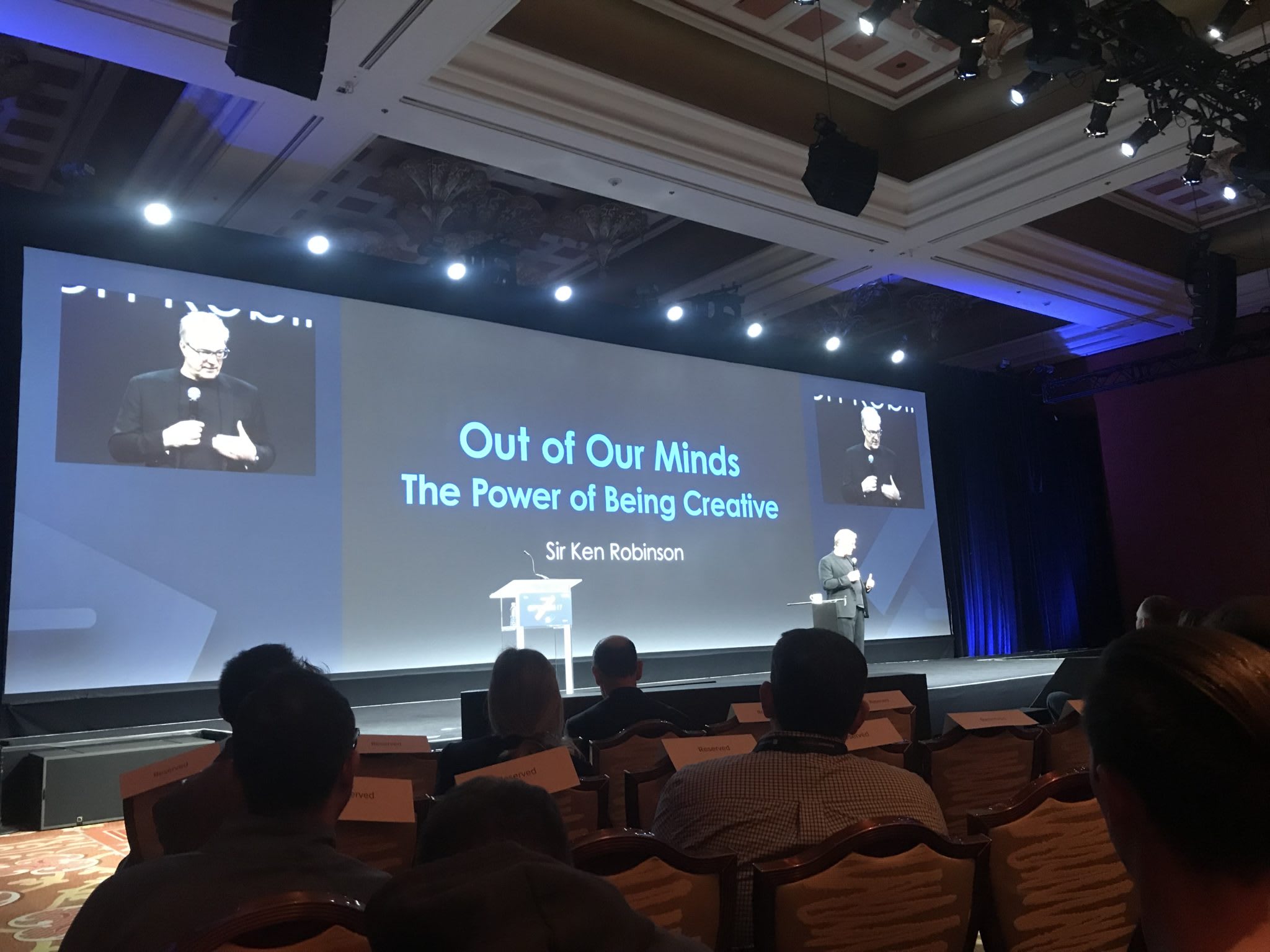 Opticon 2017 - Presentation screen w/audience. Screen reads: Out of our minds - The power of being creative.