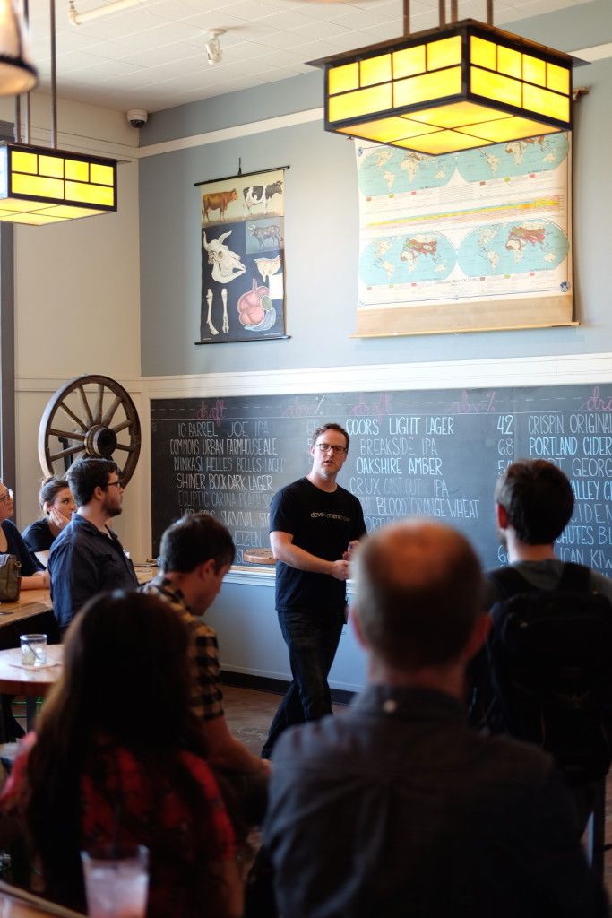 Photo of Ben Strackany, CEO of DevelopmentNow, during his presentation at Camp Optimization